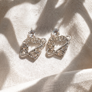 Celestial Heart Orbit Stud Earrings with sparkling crystal heart and silver-tone orbit design