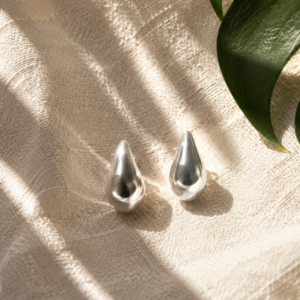 Silver teardrop stud earrings for women with polished modern design