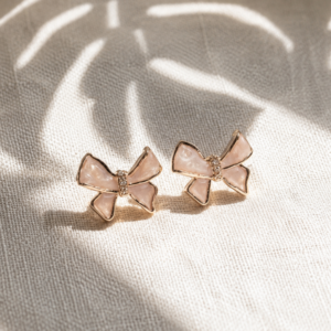 Blush pink bow stud earrings with elegant feminine design