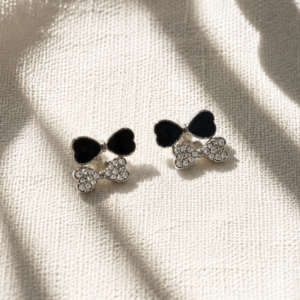 Bow crystal stud earrings with black enamel detailing for women