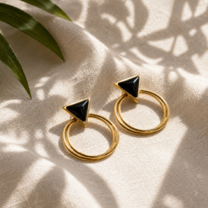 Gold geometric hoop earrings with black triangle accents and double hoop design