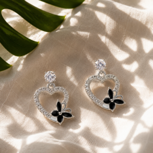 Butterfly heart earrings for women with crystal detailing and black floral accents