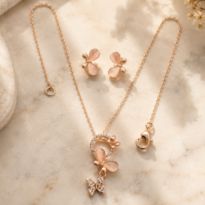 Rose gold pendant jewelry set with butterfly charm pendant and matching floral earrings