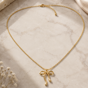 Gold bow pendant necklace for women with adjustable chain and minimalist design