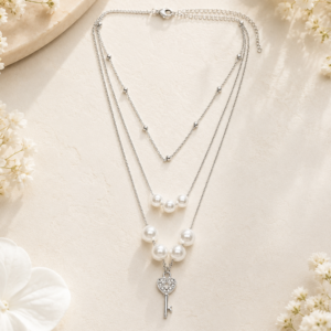 Silver pearl key layered chain for women with pearl accents and decorative key pendant