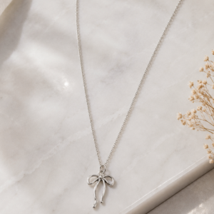 Silver Bow Chain for women with minimalist ribbon bow pendant and delicate silver chain