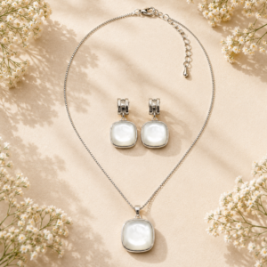 Silver pendant jewelry set with pearl-inspired pendant necklace and matching earrings