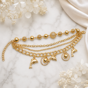 Tavielle multi-strand gold bracelet with dolphin charms and textured beads