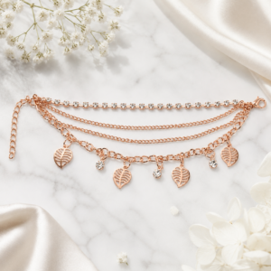 Tavielle multi-strand rose gold bracelet featuring rhinestone crystals and open leaf charms