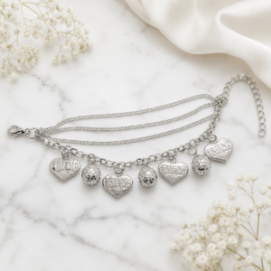 Tavielle multi-strand silver bracelet featuring engraved "Friend" heart charms and textured disco balls