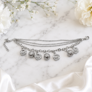 Tavielle multi-strand silver bracelet featuring dangling camellia flower charms and faceted disco balls