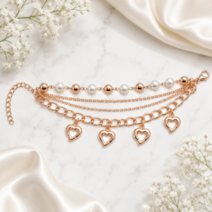 Tavielle multi-strand rose gold bracelet featuring pearl accents and open heart charms