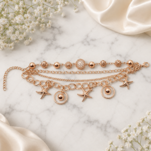 Tavielle multi-strand rose gold bracelet featuring textured beads and starfish charms
