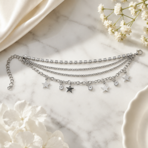 Tavielle multi-strand silver bracelet featuring a crystal tennis chain and dangling star and gemstone charms