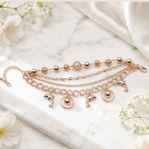 Tavielle multi-strand rose gold bracelet featuring dolphin charms and textured beads
