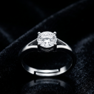 Tavielle silver ring featuring a round brilliant-cut solitaire crystal set within an open split-shank adjustable band