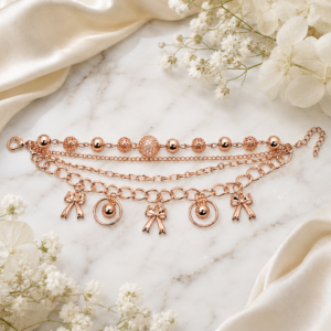 Tavielle multi-strand rose gold bracelet featuring bow charms and textured beads