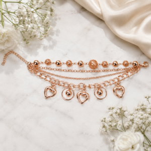 Tavielle multi-strand rose gold bracelet featuring open heart charms and textured beads