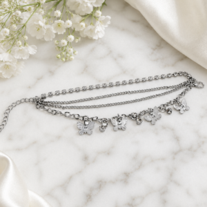 Tavielle multi-strand silver bracelet featuring a rhinestone tennis chain and butterfly charms