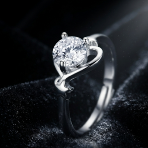 Tavielle silver ring featuring a round brilliant-cut center crystal set within an open heart and star motif adjustable band