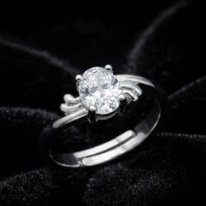 Tavielle silver ring featuring a central oval brilliant-cut crystal framed by decorative feather or wing motifs