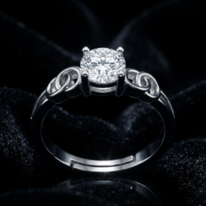 Tavielle silver ring featuring a round brilliant-cut center crystal set within an adjustable band accented with interlinked loops
