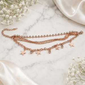 Tavielle multi-strand rose gold bracelet featuring rhinestone crystals and star charms
