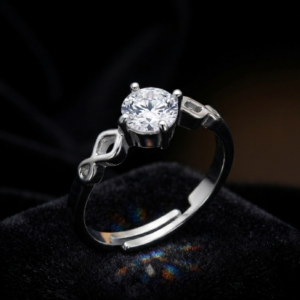 Tavielle silver ring featuring a round brilliant-cut center crystal set within an open infinity symbol adjustable band