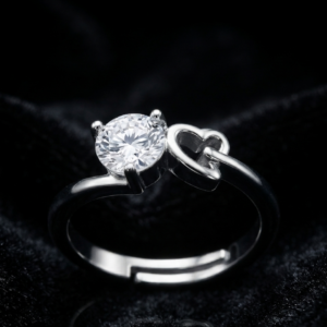 avielle silver ring featuring a round brilliant-cut center crystal set next to interlinked double heart motifs
