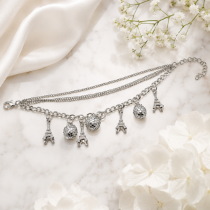 Tavielle multi-strand silver bracelet featuring dangling Eiffel Tower and faceted disco ball charms